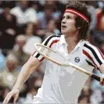John McEnroe preparing to smash an overhead